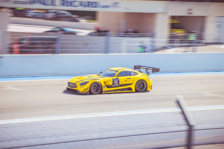 the sports car is driving around a track