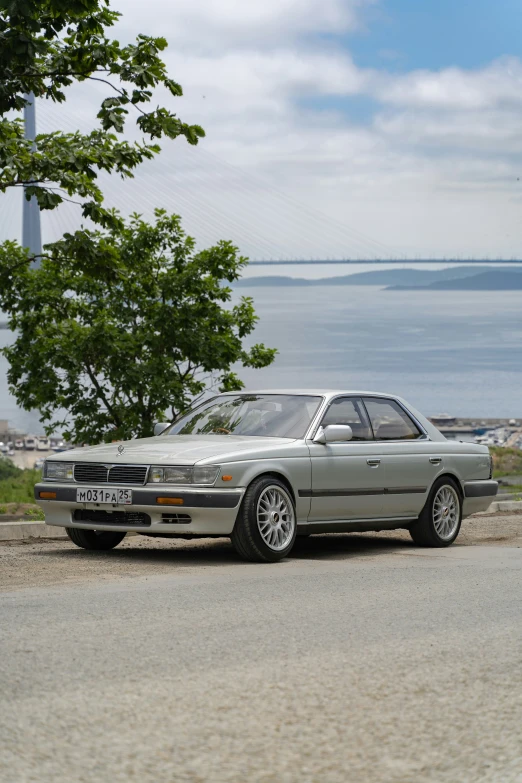 a bmw car on the road by water