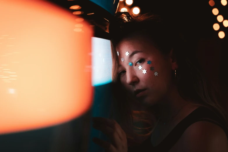 a girl is shown with white stars painted on her body