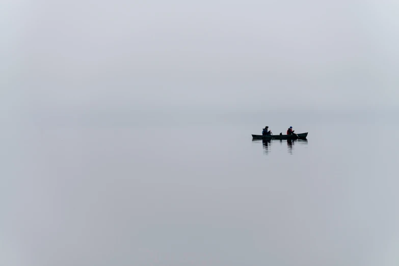 two people are on the water with their paddles