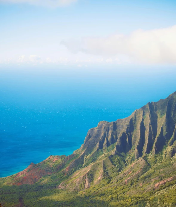 a beautiful scenery at a mountainside near the sea