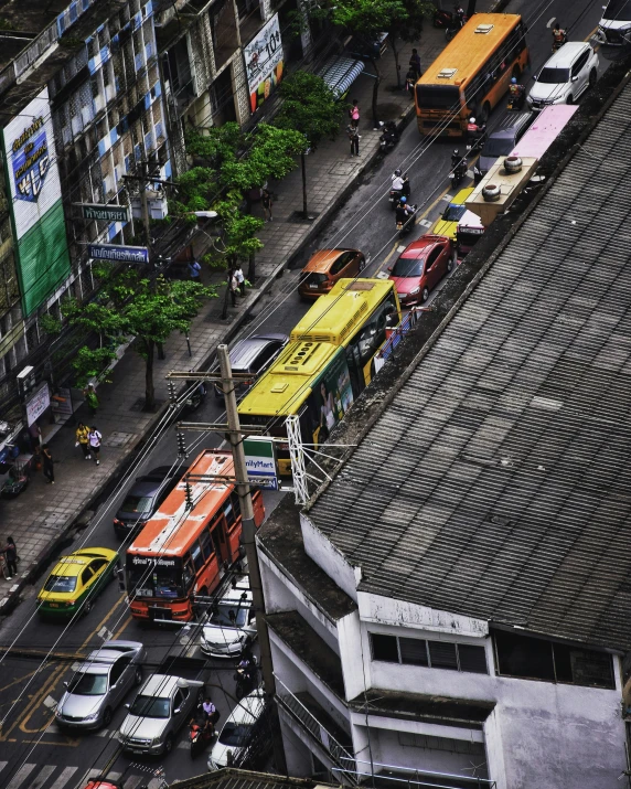 a group of buses that are in the street