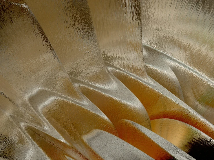 close up of a silver vase with orange decoration