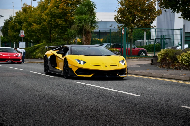 a red sports car and a yellow sports car