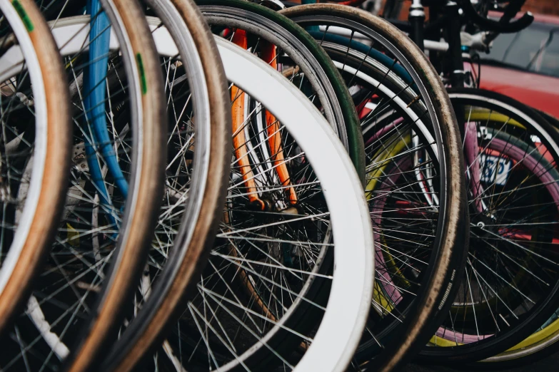 several different types of bicycles parked in rows