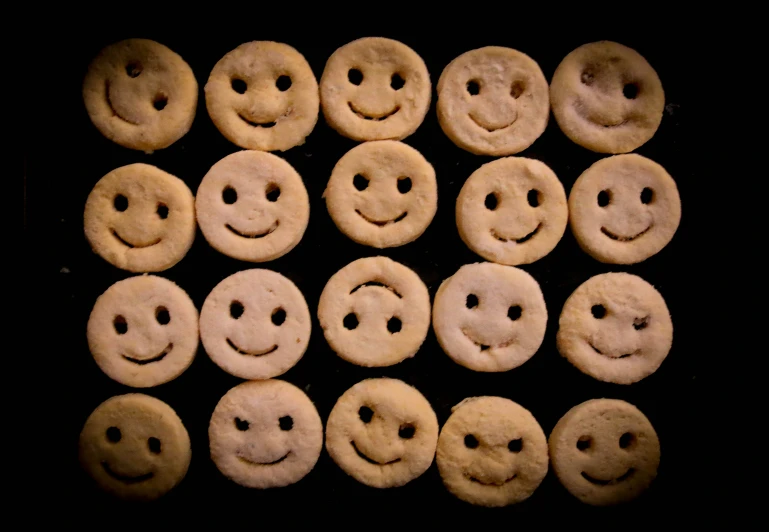 many different kinds of biscuits with smiley faces