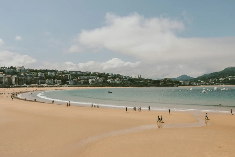 people are at the beach in front of the ocean