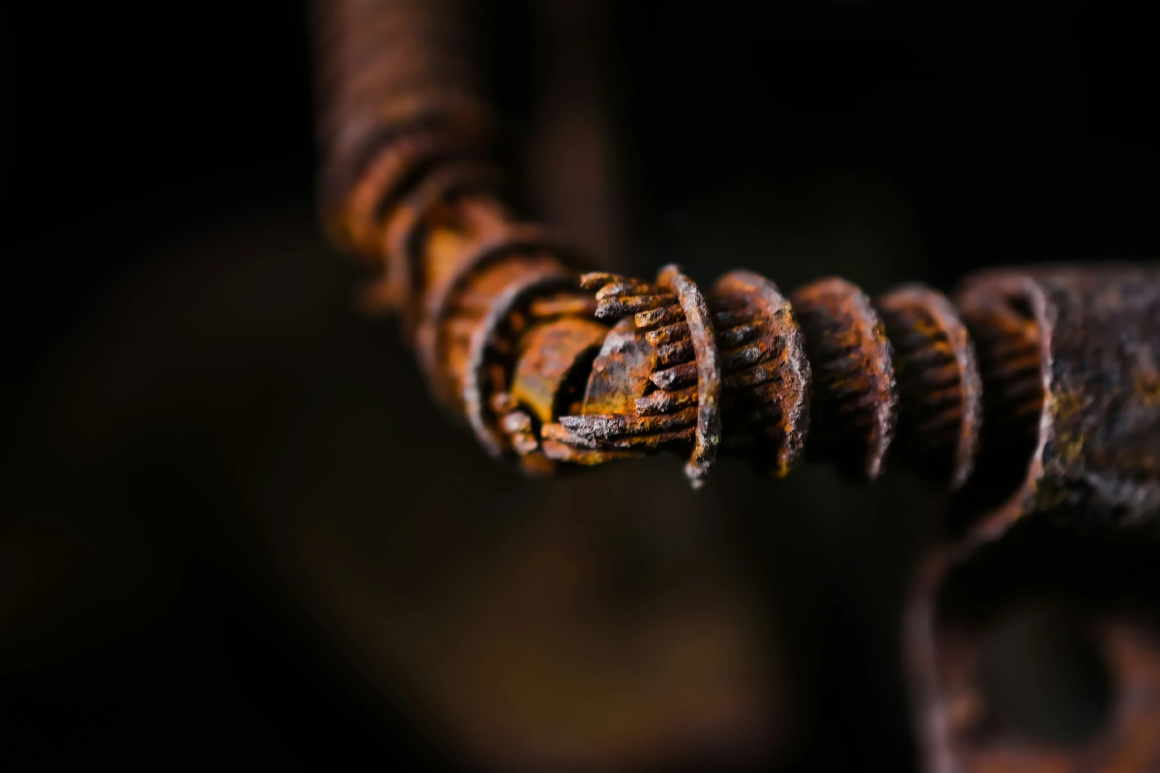 an old rusted metal hose is attached to the end