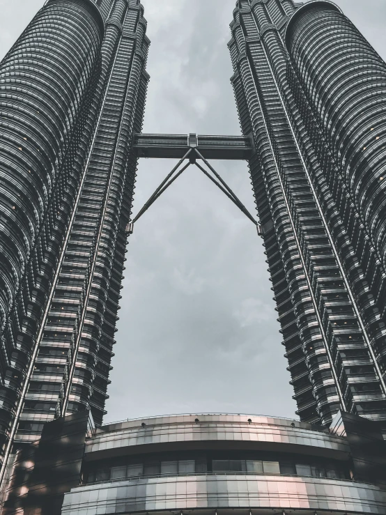 two large high rise buildings against the sky