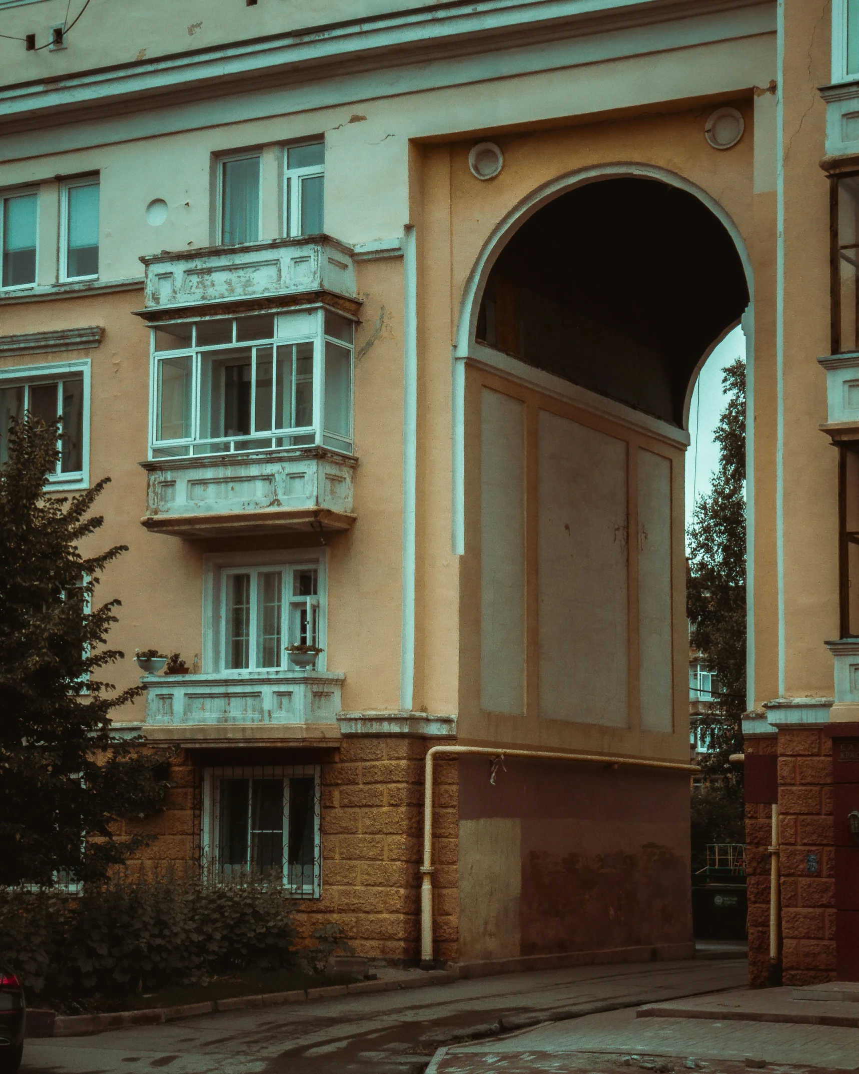 an old apartment building with an open front entrance