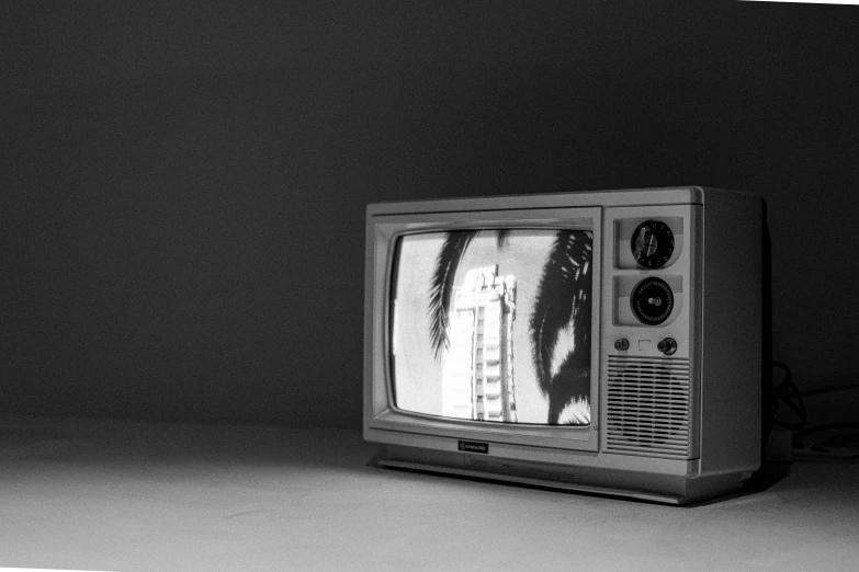 a tv sitting in the corner of a dark room