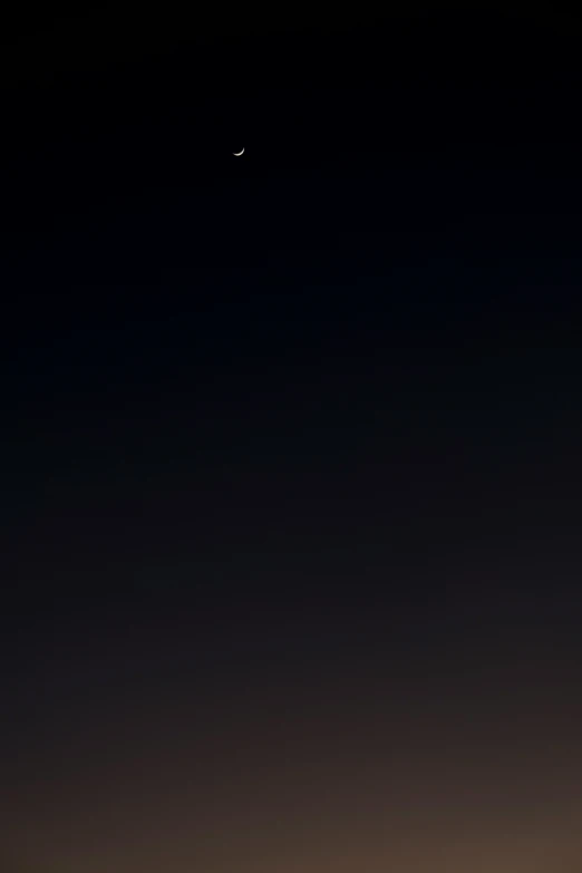the view at night shows some distant distant stars and the moon