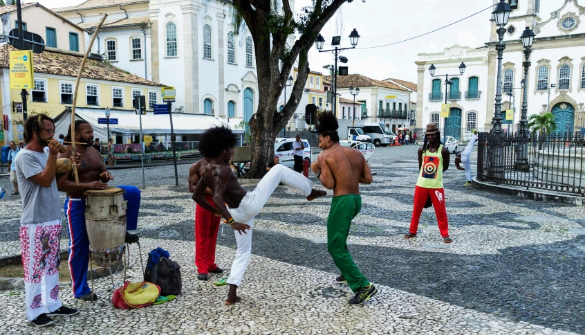 people standing around on the street with various costumes