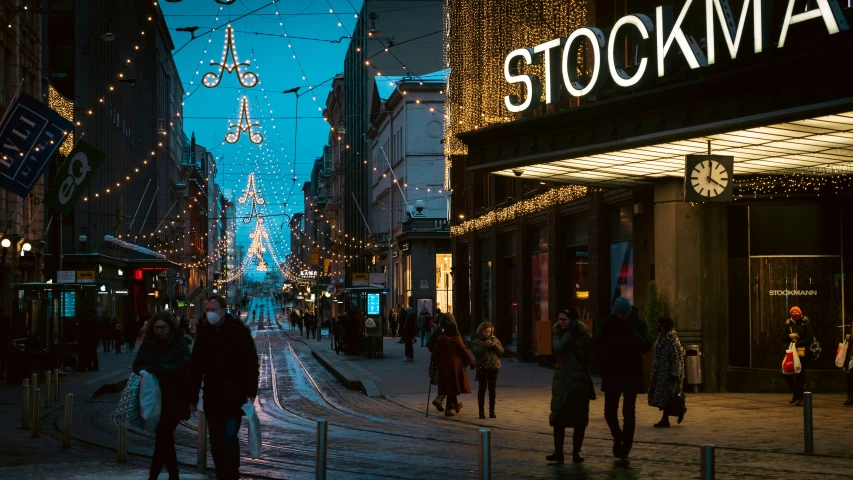 there are many people walking on a busy street