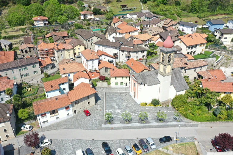 small village with orange roofed roofs in rural region