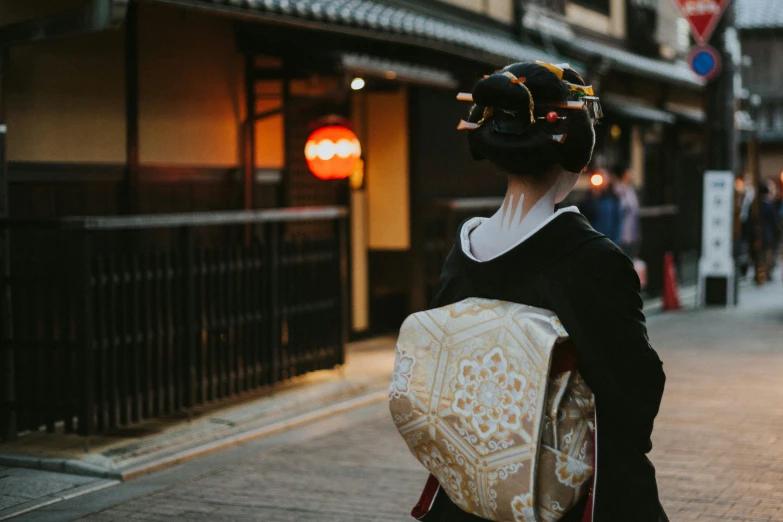 a woman wearing a black and gold costume in a foreign country