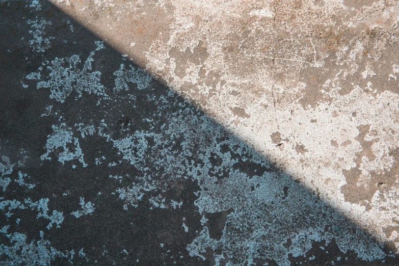 a black and blue background with a gray carpet