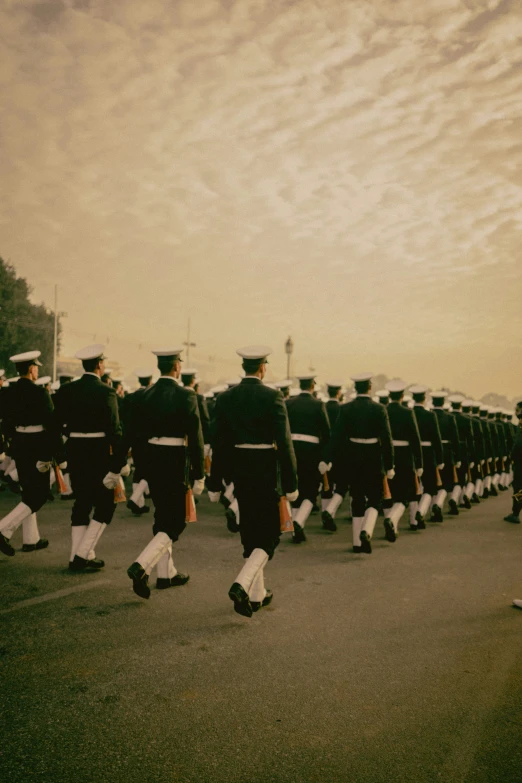 the soldiers in black uniforms walk through the street