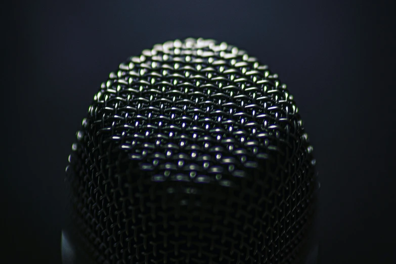 a closeup s of a metal fidget on a black background