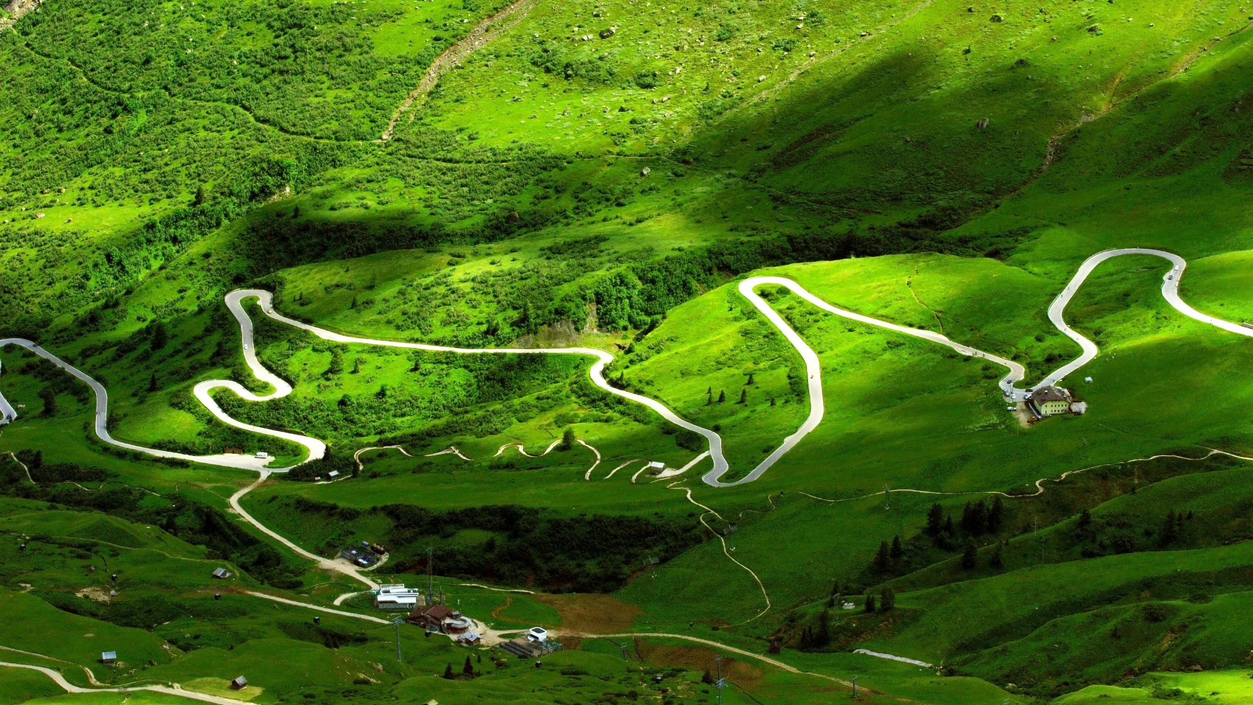 an overhead view of a green mountainside with a line drawn in to it