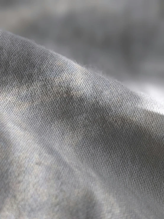 grey background of the fabric with very little blur