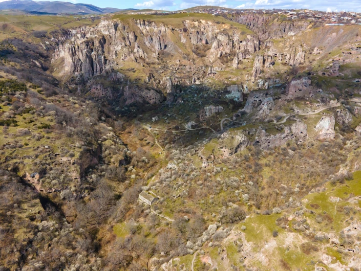 a view from an airplane of cliffs and valleys