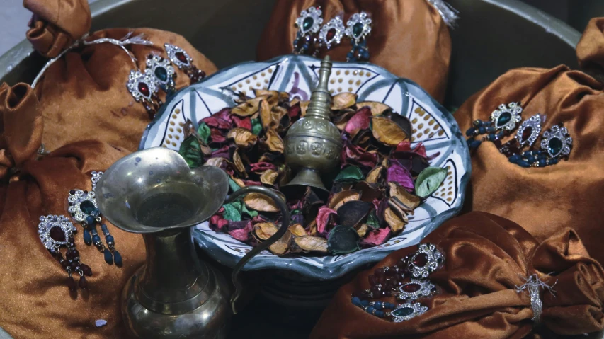 silver and red items on a white plate