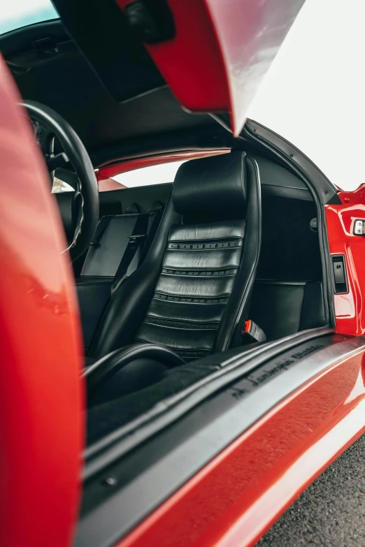 the open doors of a red sports car