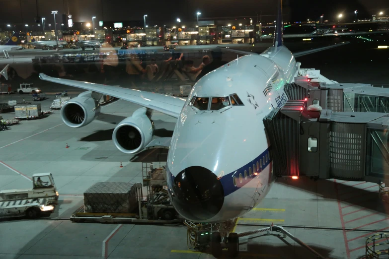 an airplane is being loaded at the terminal