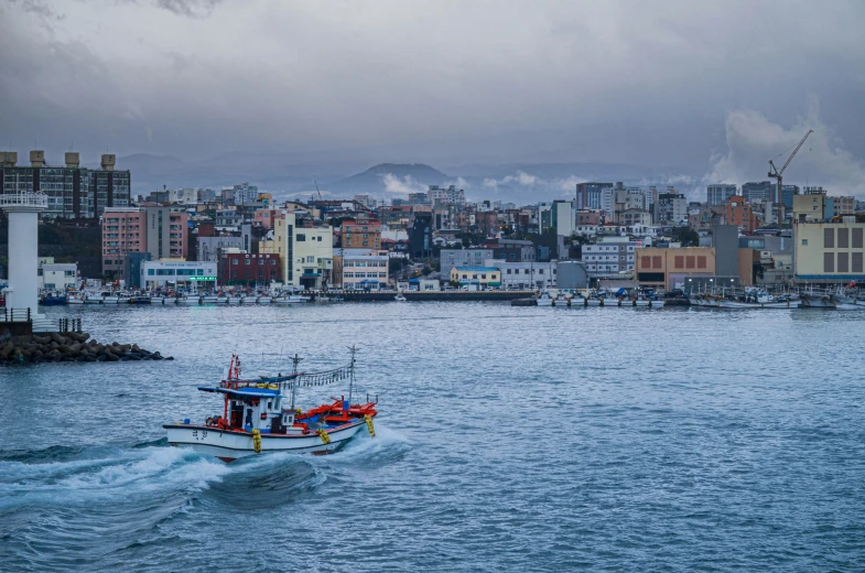 there is a boat with people on it coming through the water