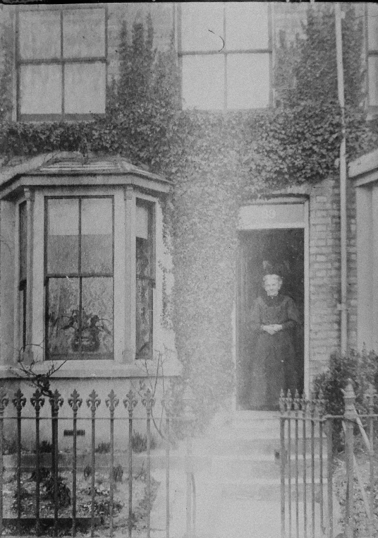 black and white image of the back side of an old house