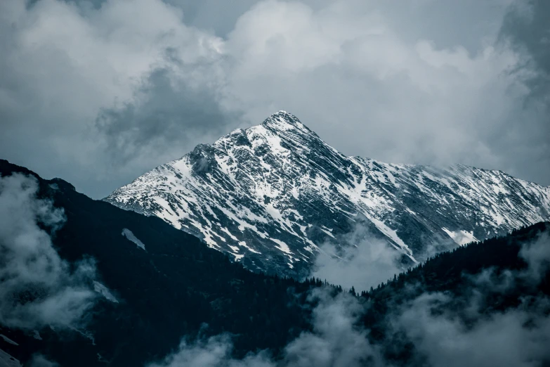 a view of a mountain in the clouds