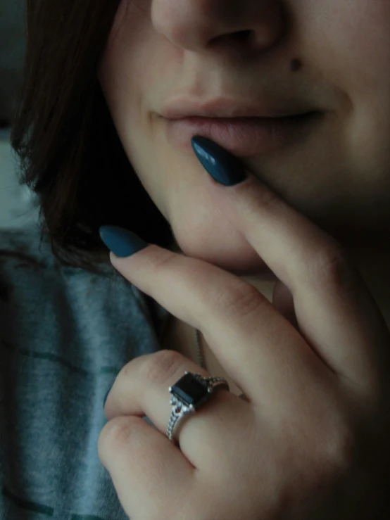 a woman has a ring on her finger