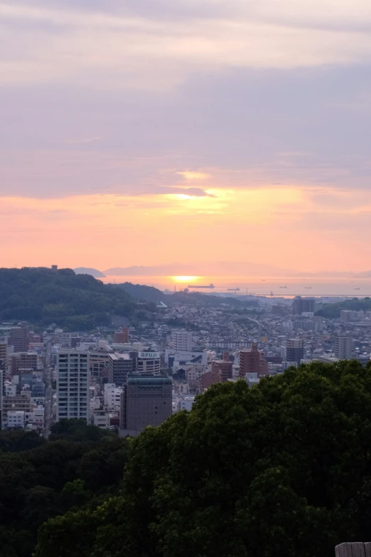 a view of the city from an area near a hill