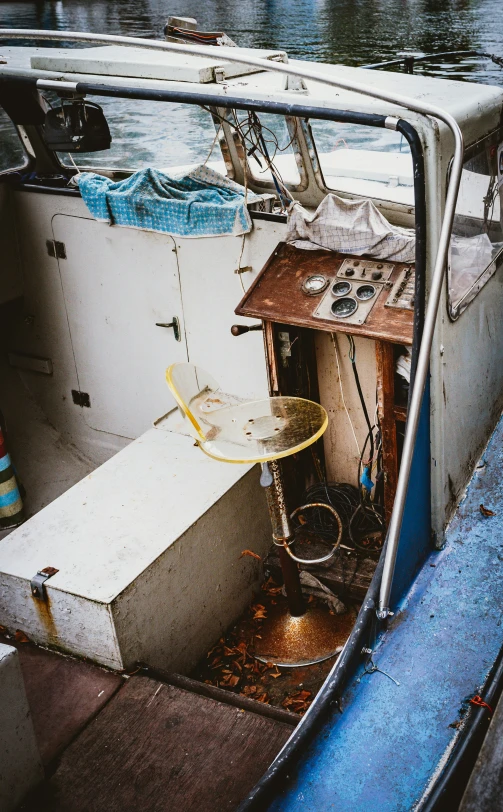 a boat sitting near the water at a dock