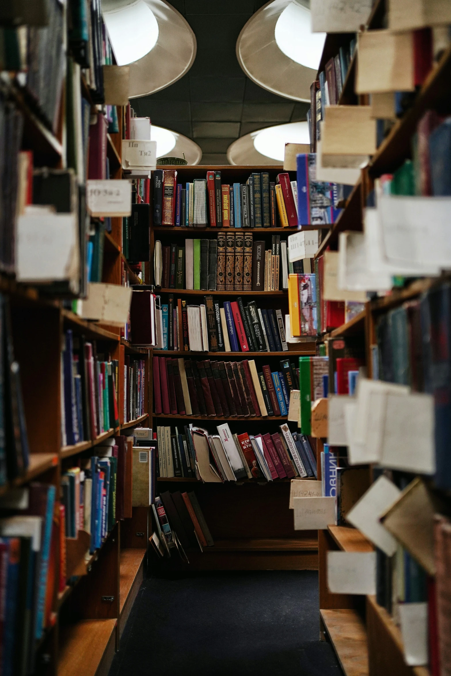 this is a bookshelf full of books with lamps