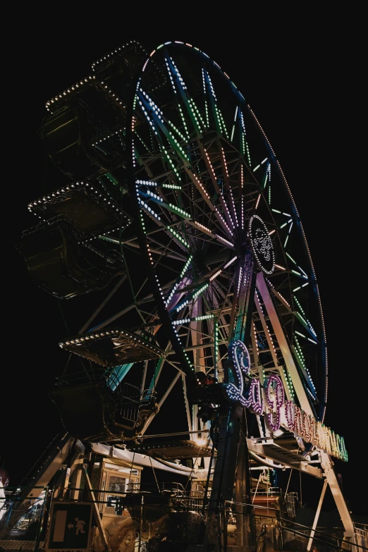 an amut ride is lit up at night