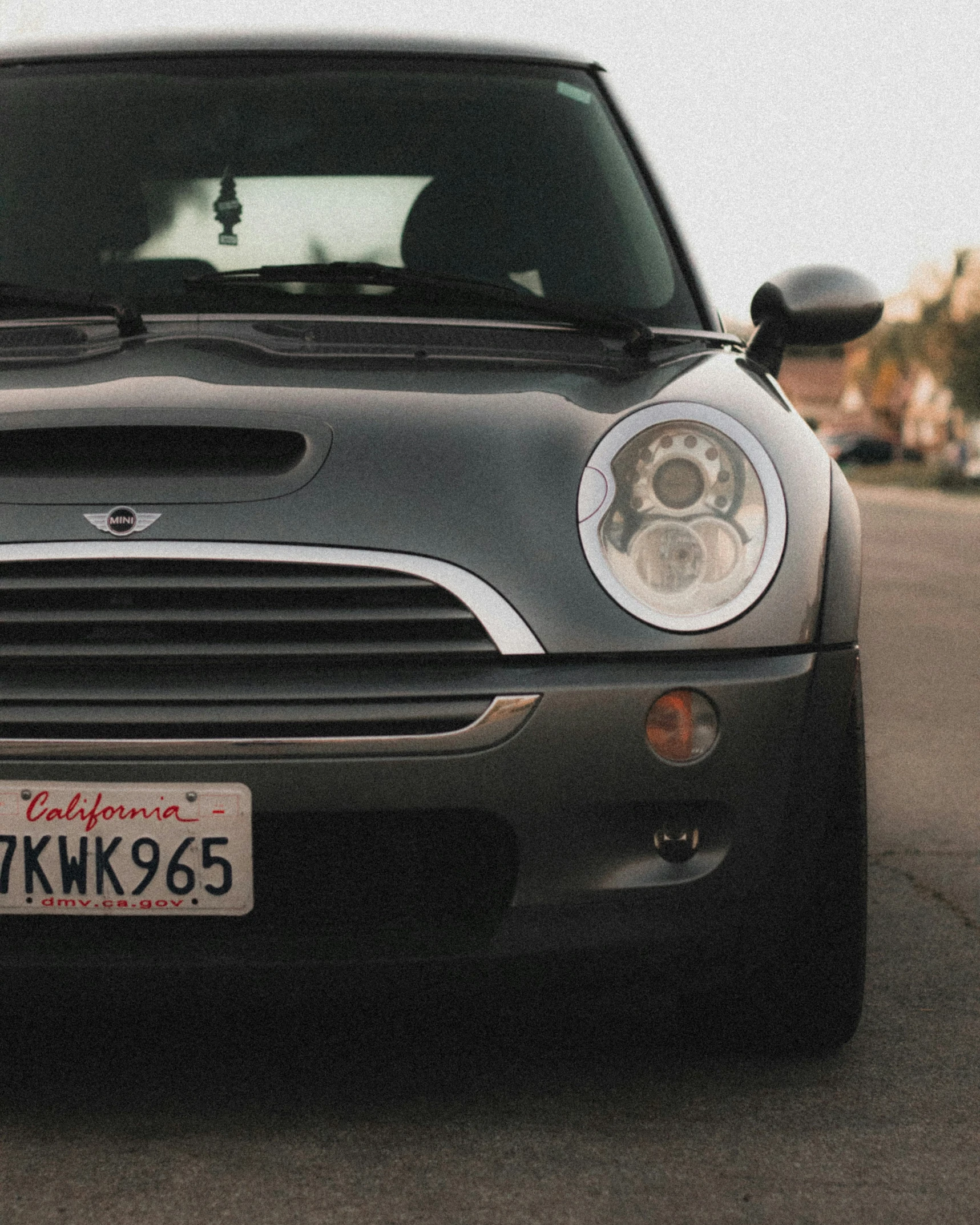 the front end of a silver mini - hardtop car