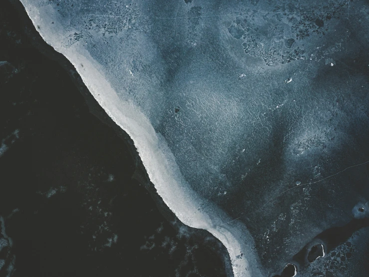 an aerial view of a waterway in the dark