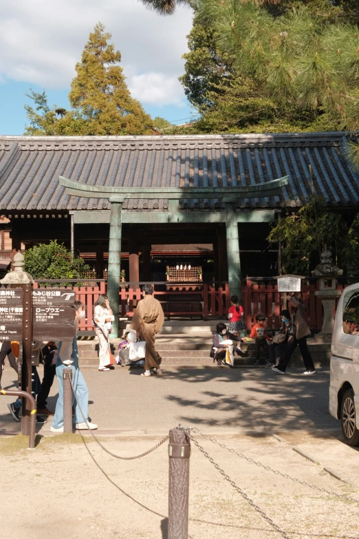 a man is walking away from an asian restaurant