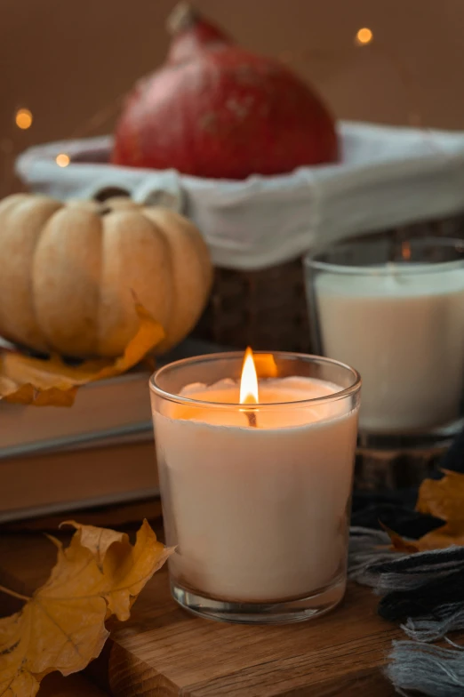 a candle that is sitting on a wooden table