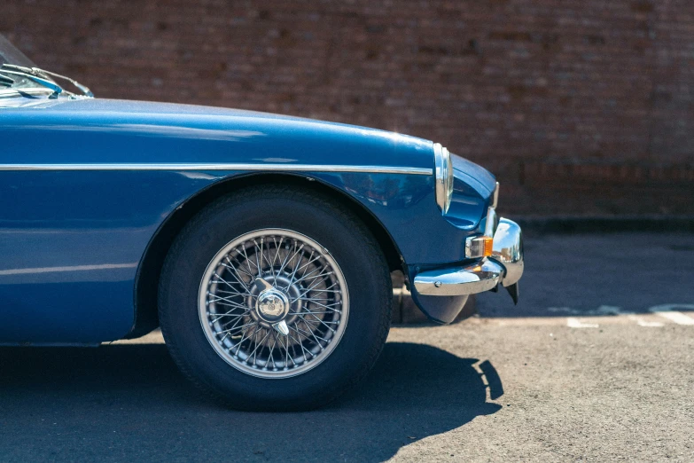 an old classic car parked in the parking lot