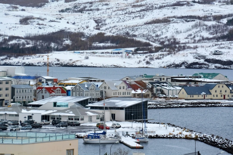 a scenic po of a town and a body of water