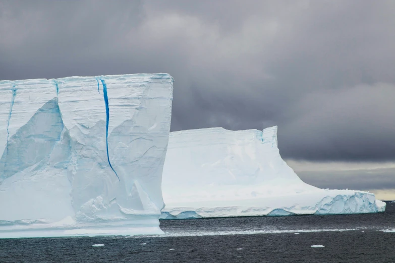 an iceberg floating in a body of water