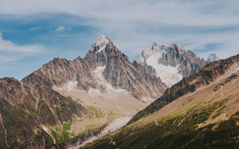 a group of mountains and valleys covered in snow