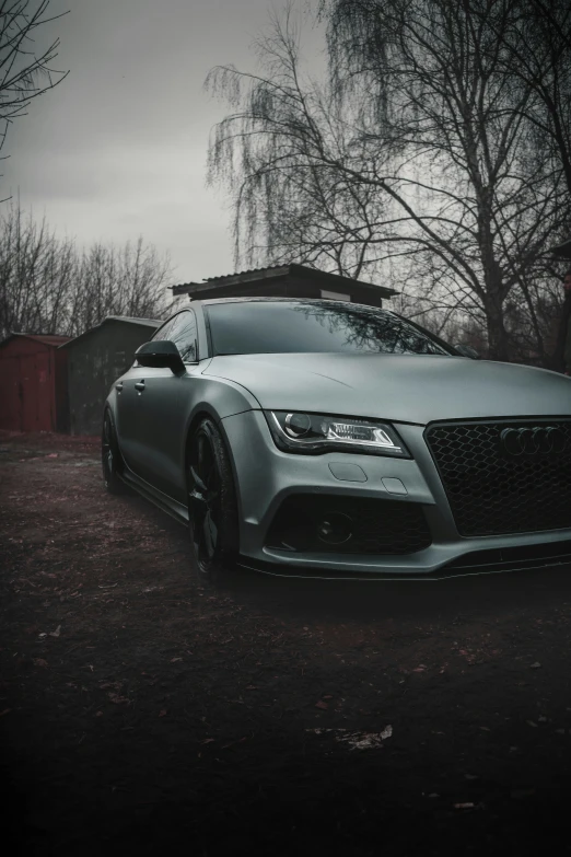 a black and white po of an audi car in the snow