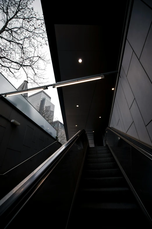 an escalator at night in an underground subway