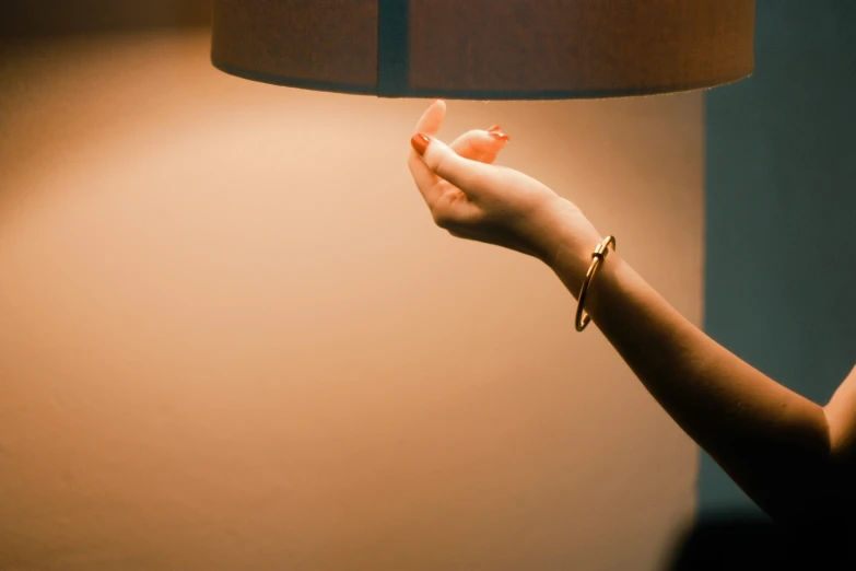 a hand holding a small piece of glass