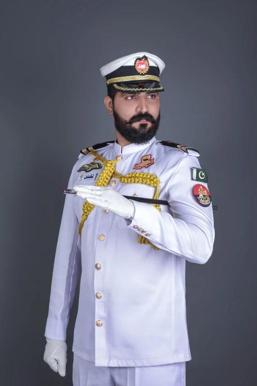 a man dressed in uniform posing for the camera