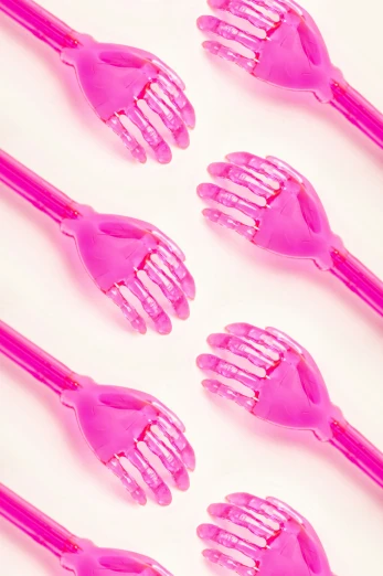 a group of pink combs sitting next to each other